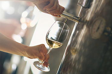 White wine being poured from the tank - Sauvignon Blanc Winemaker Q & A